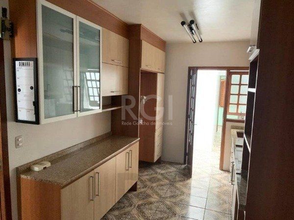 Casa no bairro Jardim Botânico de 3 dormitórios — foto 8