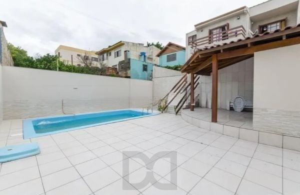 Casa / sobrado no bairro Jardim Itu de 3 dormitórios e pátio com piscina — foto 34