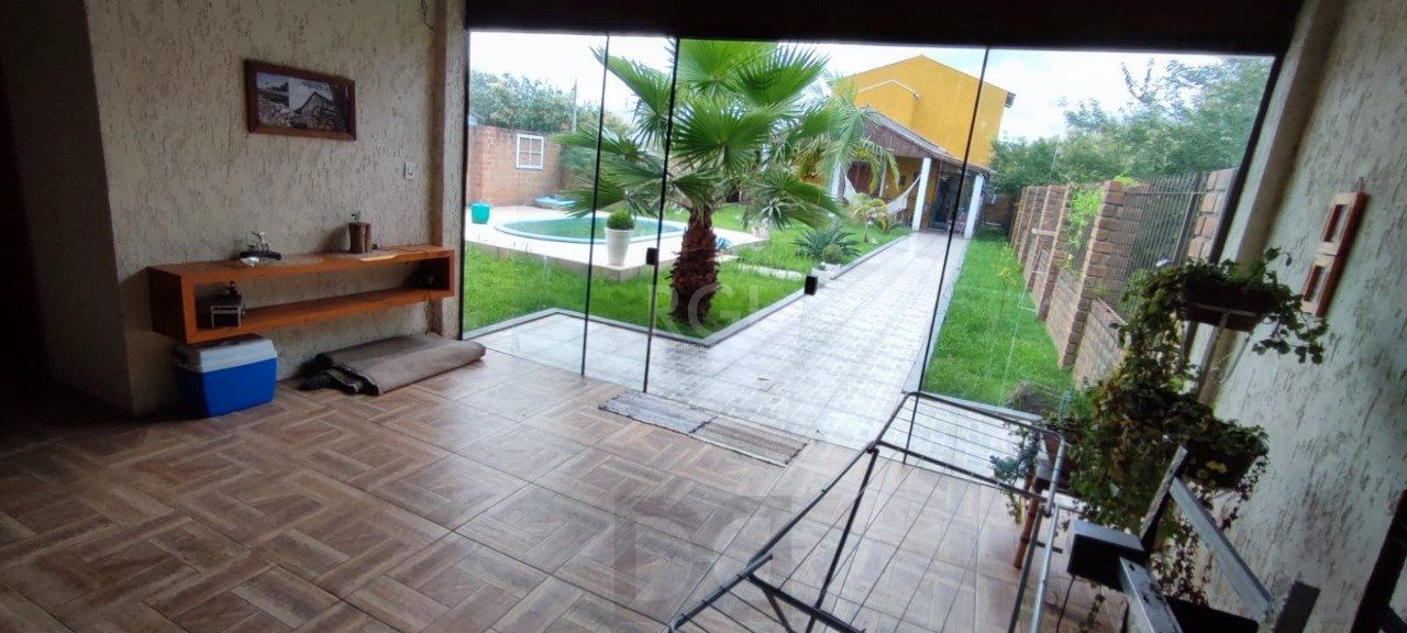 Casa com Piscina no bairro Lami — foto 23