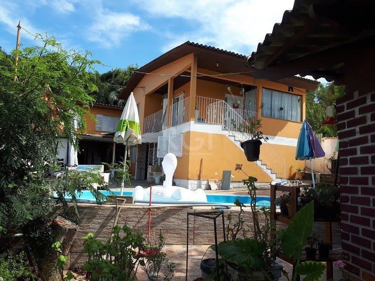 Casa com 4 dormitórios no bairro Vila Nova — foto 2