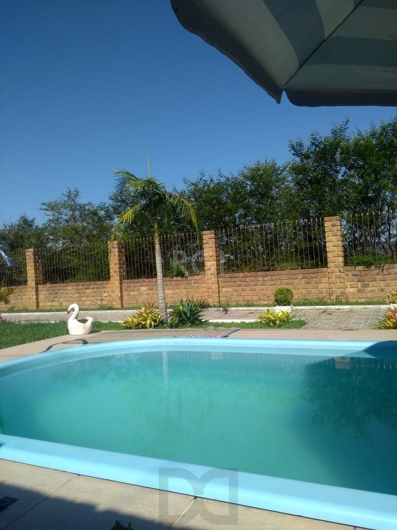 Casa com Piscina no bairro Lami — foto 14