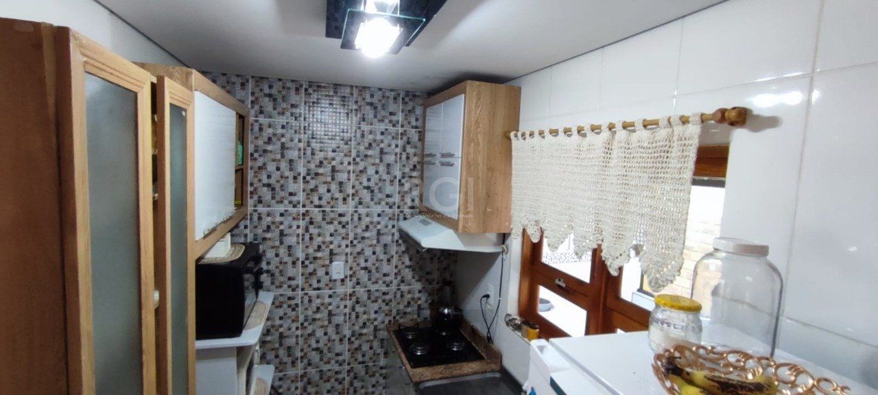 Casa com Piscina no bairro Lami — foto 15