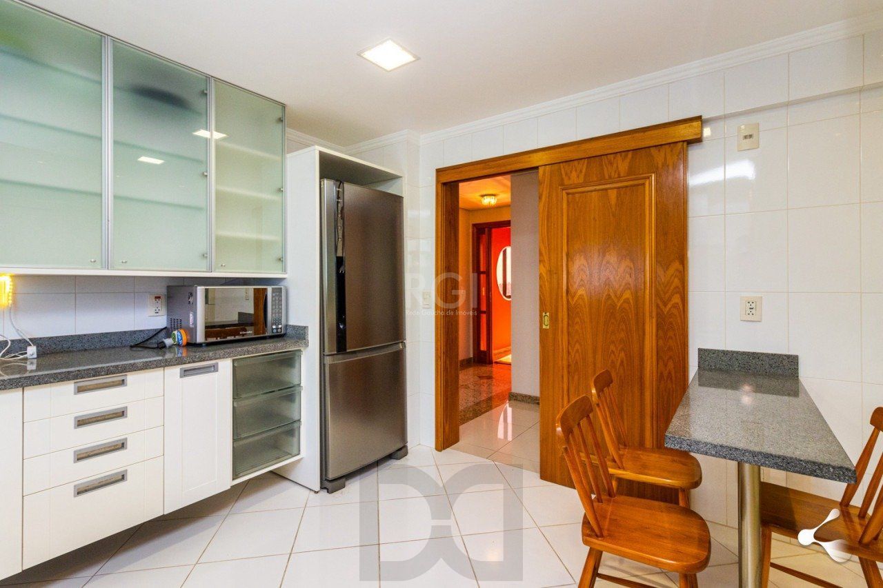 195m churrasqueira, 3 suites, 4 vagas semimobiliado no bairro Rio Branco, Poa/RS — foto 31