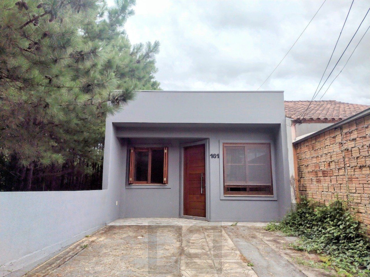 CASA TÉRREA - 2 DORMITÓRIOS, ÁREA COBERTA COM CHURRASQUEIRA , TERRAÇO - 02 VAGAS — foto 2