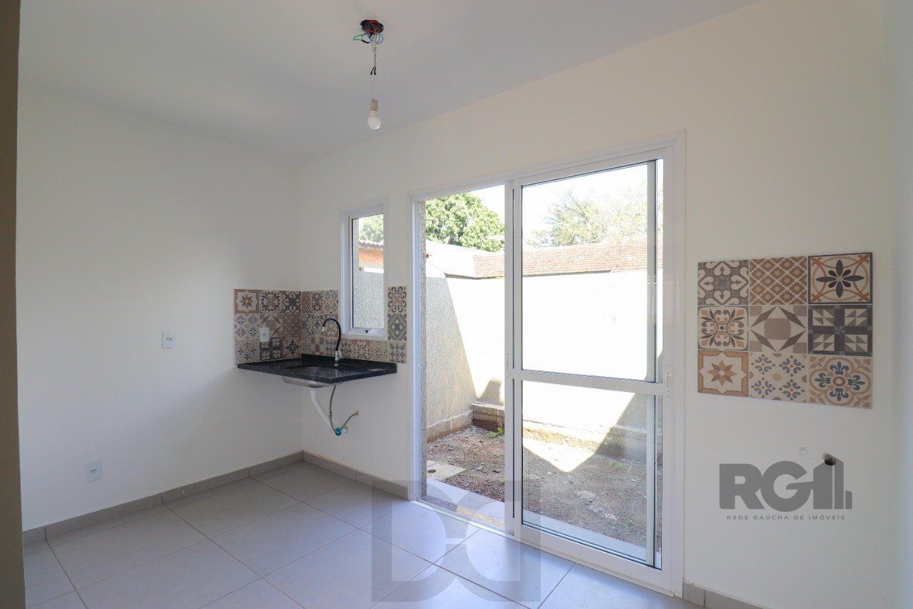 CASA ESTILO SOBRADO COM 2 QUARTOS E PÁTIO, À VENDA NO BAIRRO VILA NOVA, EM PORTO ALEGRE/RS — foto 17