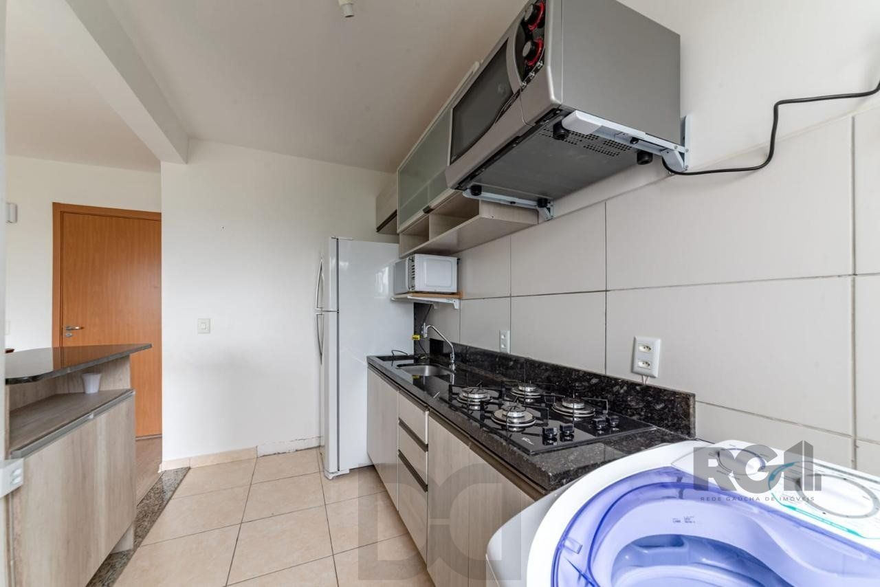Apartamento 2 dormitórios e uma vaga no bairro morro santana com sacada. — foto 7