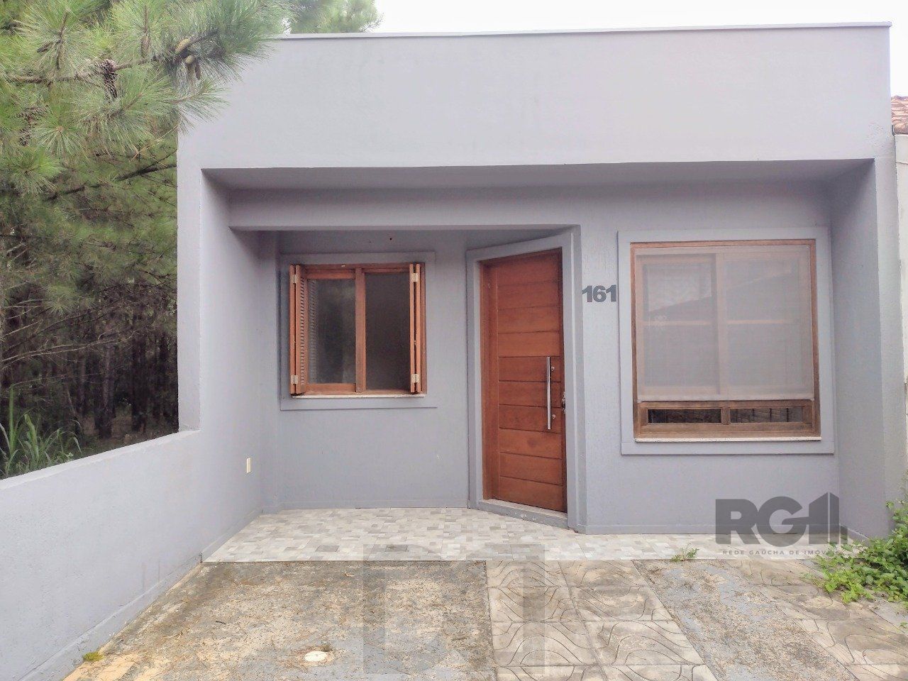 CASA TÉRREA - 2 DORMITÓRIOS, ÁREA COBERTA COM CHURRASQUEIRA , TERRAÇO - 02 VAGAS — foto 1
