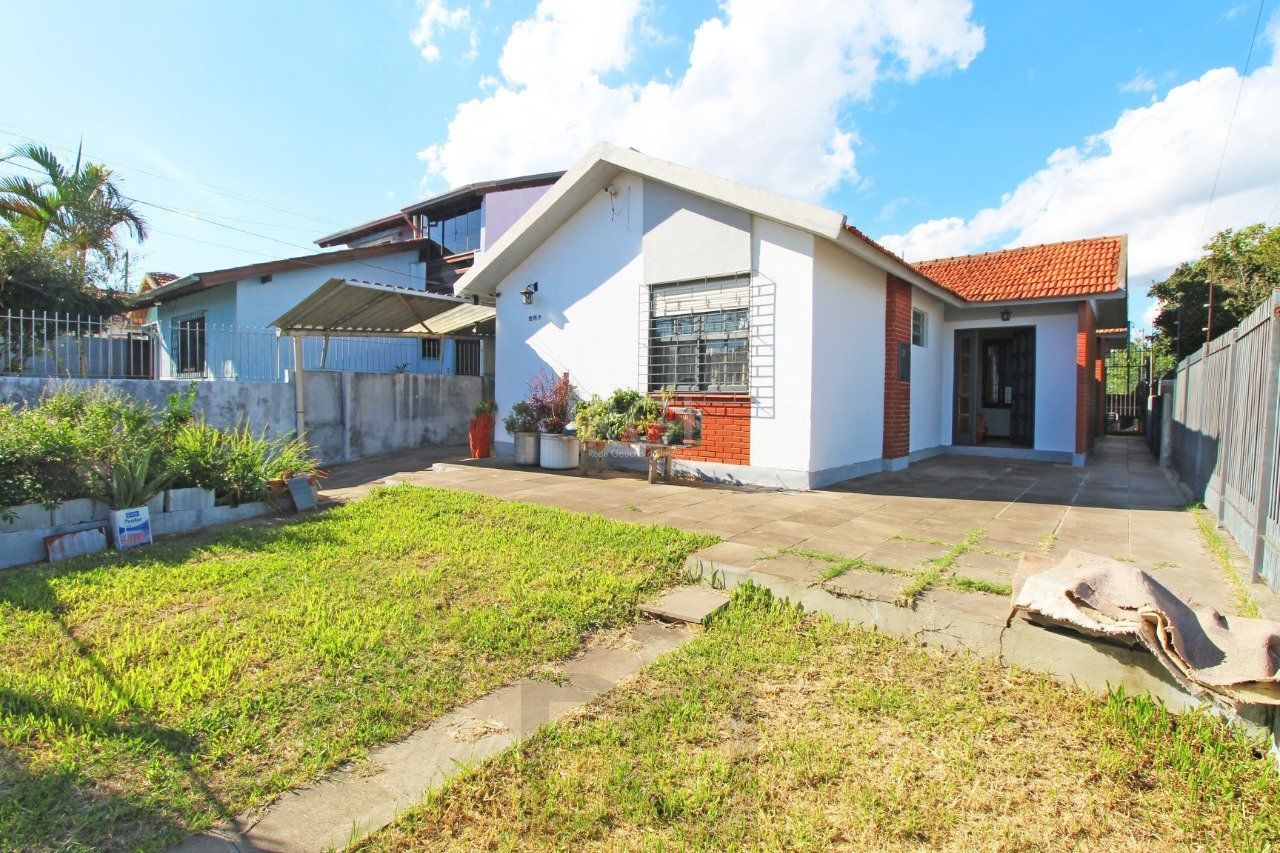 Casa 5 dormitórios, 1 suíte, 2 vagas de garagem, no bairro Camaquã, Poa/RS. — foto 1