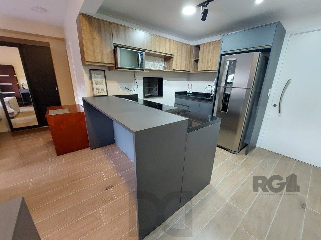 Apartamento stidio com 1 dormitório, 1 vaga de garagem no Bairro Auxiliadora. — foto 14