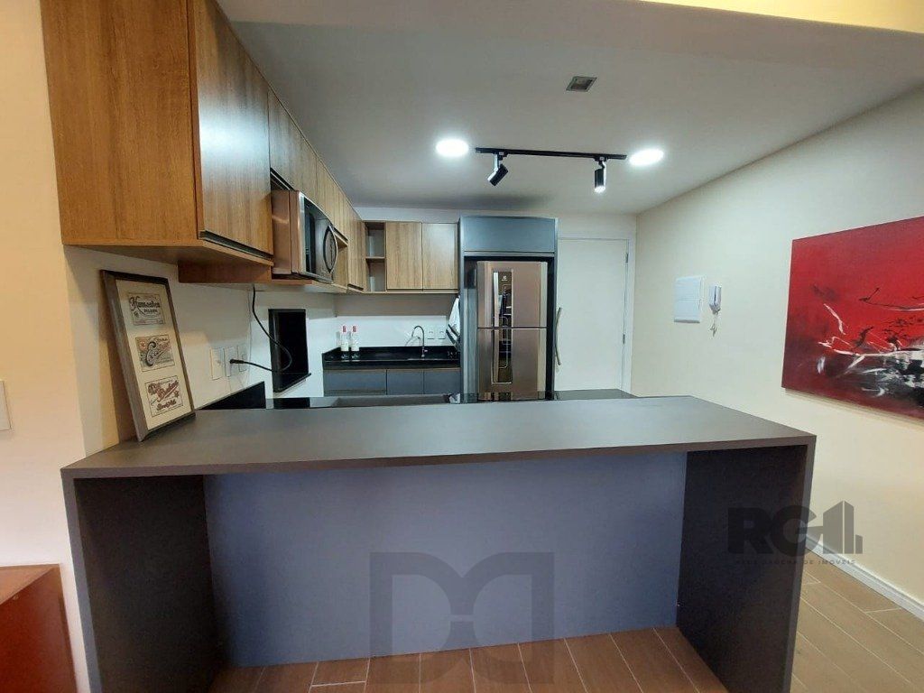 Apartamento stidio com 1 dormitório, 1 vaga de garagem no Bairro Auxiliadora. — foto 12