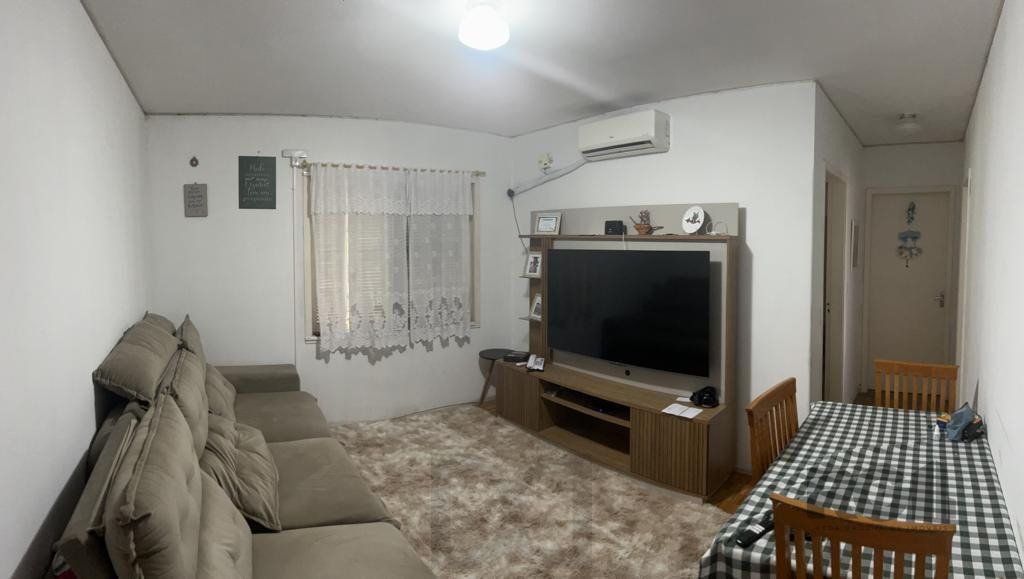 Apartamento de 2 dormitórios, living, cozinha, área de serviço e banheiro social. — foto 1