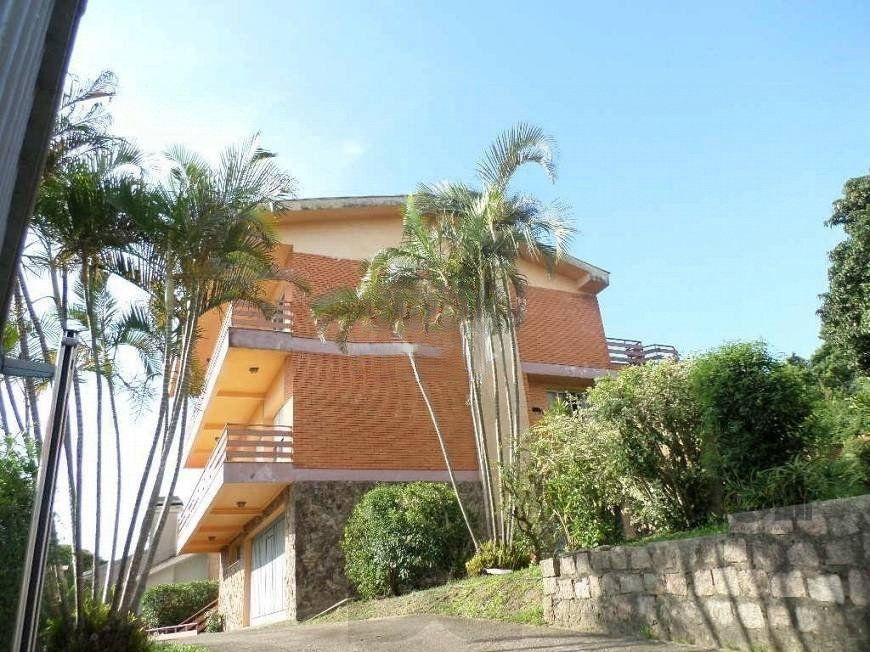residência com vista panorâmica espetacular para o Guaíba em todos os cômodos da casa, hall de entrada, gabinete, lavabo, living para três ambientes com sacada e vista — foto 1
