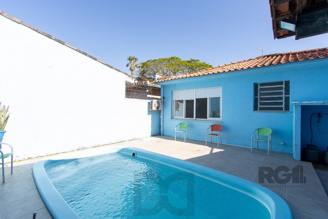 Casa térrea, com 3 dormitórios, 1 suíte, no bairro Ipanema. — foto 39