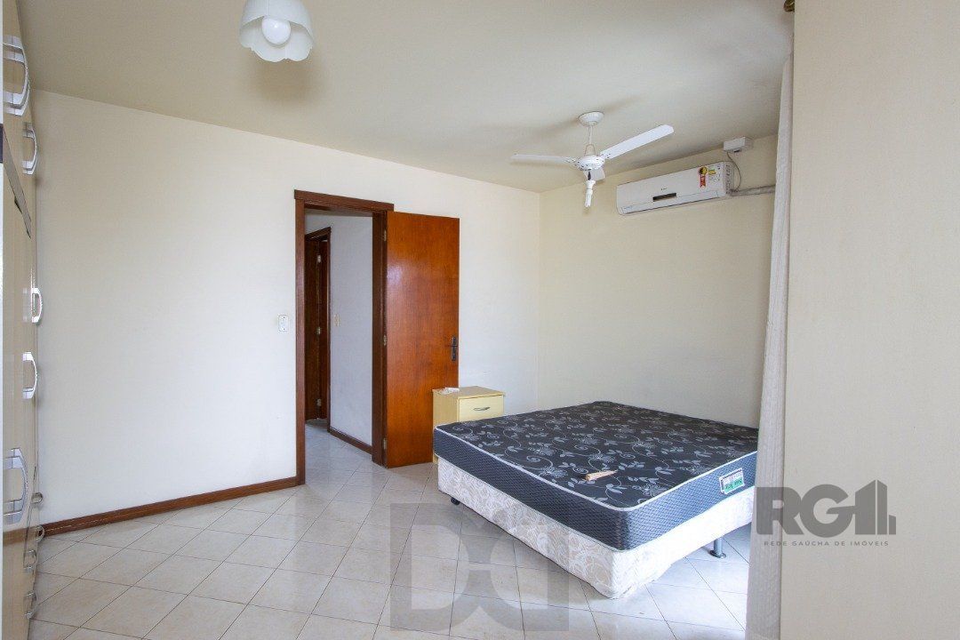 Casa em Condomínio na Zona Sul, no bairro Hípica, com 2 dormitórios, living para dois ambientes, cozinha mobiliada, lavabo — foto 26