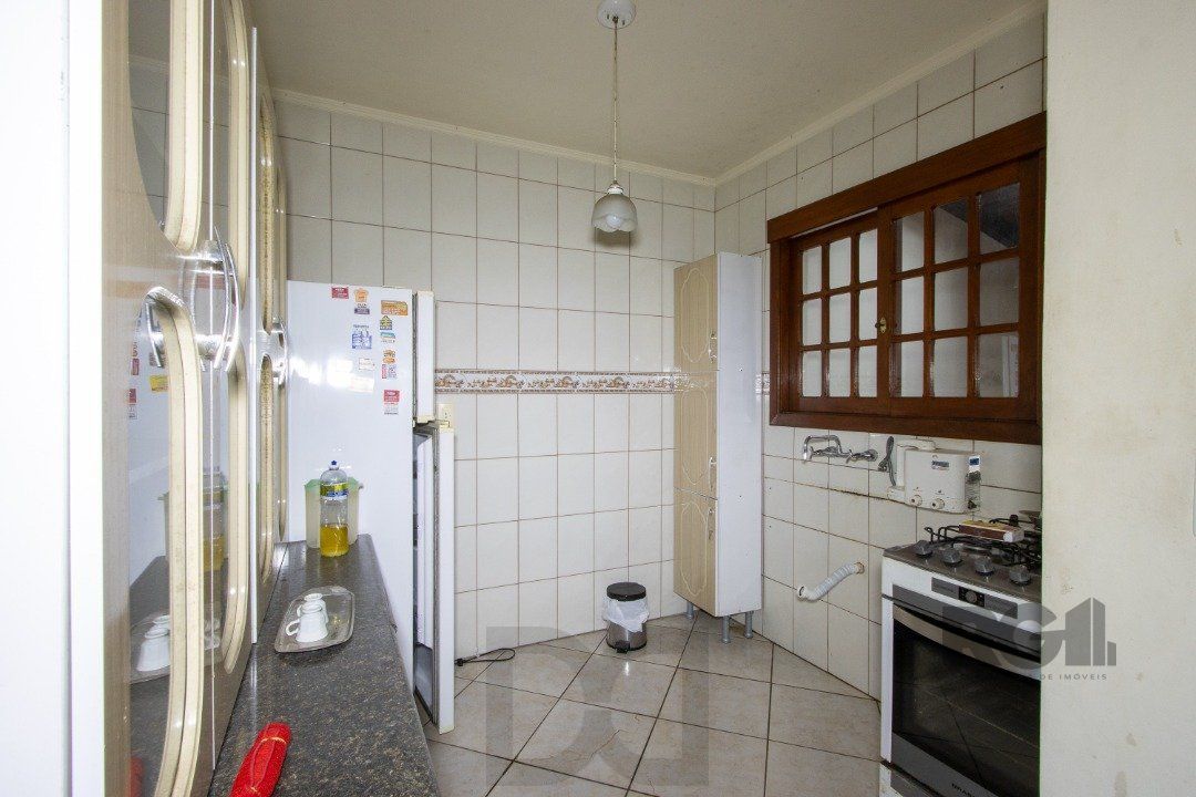 Casa em Condomínio na Zona Sul, no bairro Hípica, com 2 dormitórios, living para dois ambientes, cozinha mobiliada, lavabo — foto 8