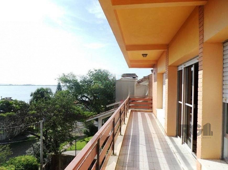 residência com vista panorâmica espetacular para o Guaíba em todos os cômodos da casa, hall de entrada, gabinete, lavabo, living para três ambientes com sacada e vista — foto 3