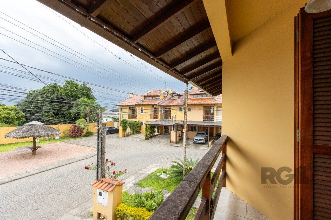 Casa em Condomínio na Zona Sul, no bairro Hípica, com 2 dormitórios, living para dois ambientes, cozinha mobiliada, lavabo — foto 23