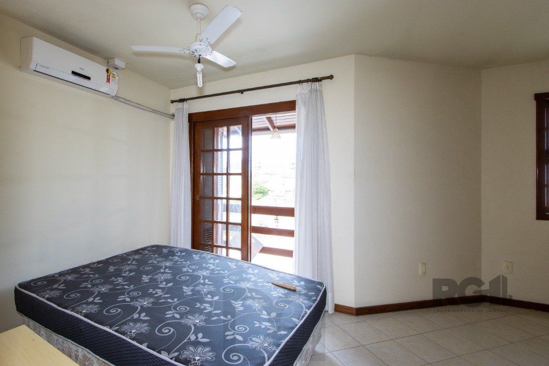 Casa em Condomínio na Zona Sul, no bairro Hípica, com 2 dormitórios, living para dois ambientes, cozinha mobiliada, lavabo — foto 20