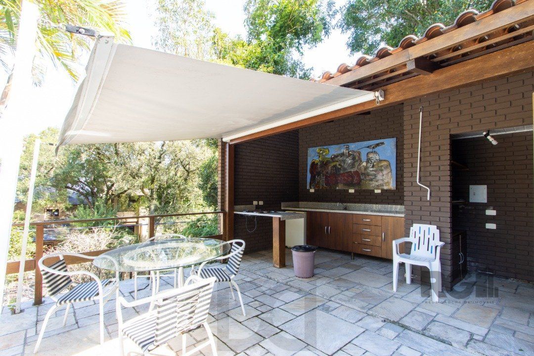 Casa deslumbrante vista do Guaiba, 3 dormitórios, sendo 1 suite master com closet e banheira de hidro com vista para o rio — foto 45