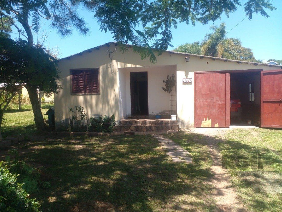 Dois quartos, 01 banheiro, 01 sala de star, 01 sala de jantar, cozinha, 01 garagem para três carros com churrasqueira. — foto 3