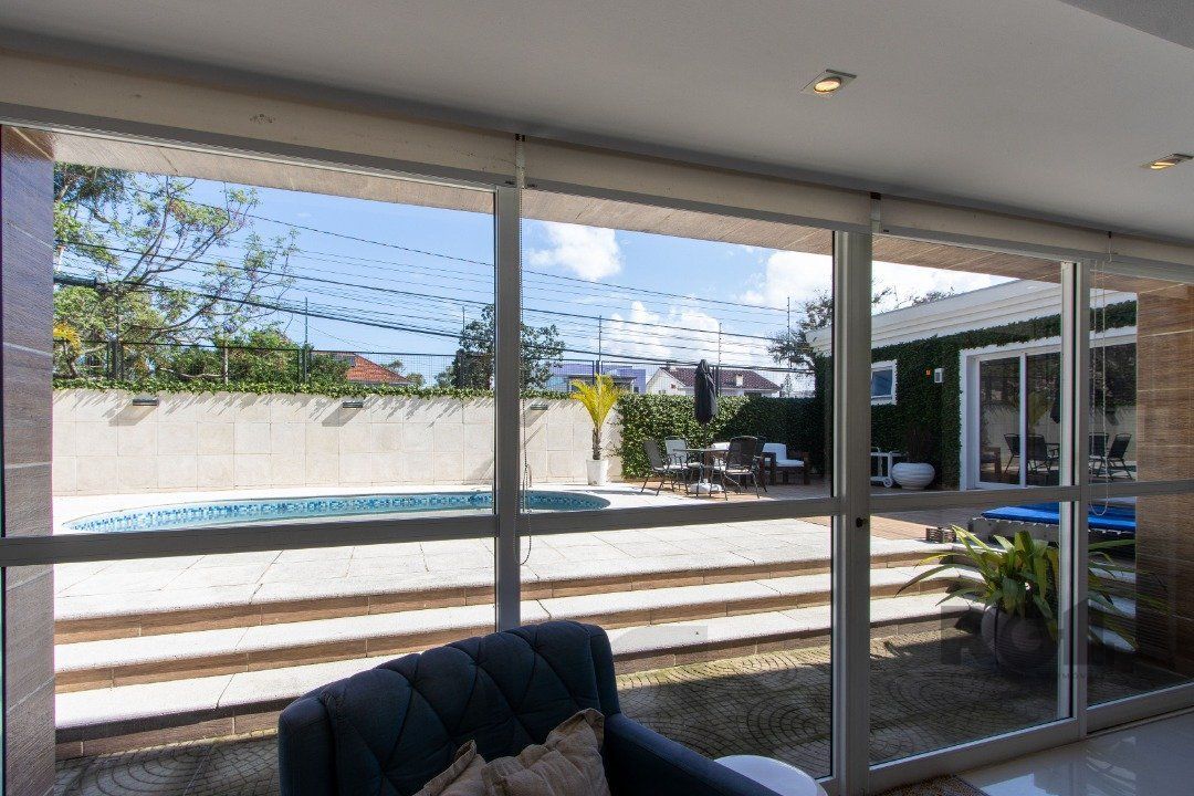 Casa a venda no bairro Guarujá com 4 dormitórios, piscina e salão de festas — foto 11