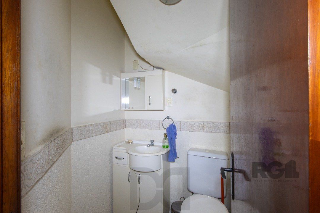 Casa em Condomínio na Zona Sul, no bairro Hípica, com 2 dormitórios, living para dois ambientes, cozinha mobiliada, lavabo — foto 7