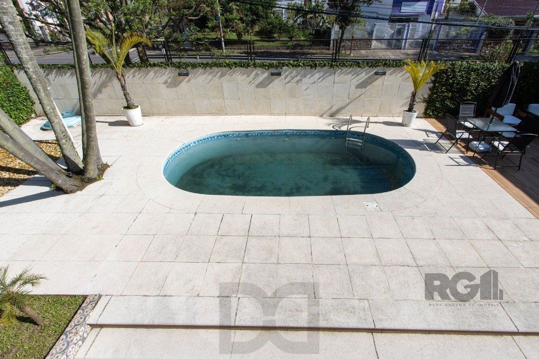 Casa a venda no bairro Guarujá com 4 dormitórios, piscina e salão de festas — foto 46