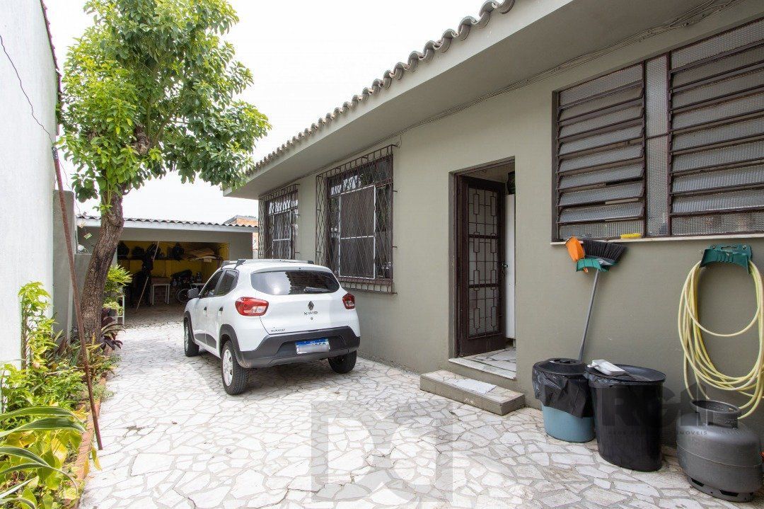 Casa térrea, 3 quartos, 2 banheiros, com pátio no Bairro Cavalhada — foto 31