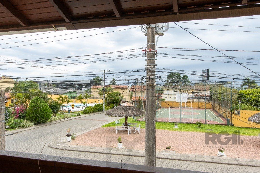 Casa em Condomínio na Zona Sul, no bairro Hípica, com 2 dormitórios, living para dois ambientes, cozinha mobiliada, lavabo — foto 22