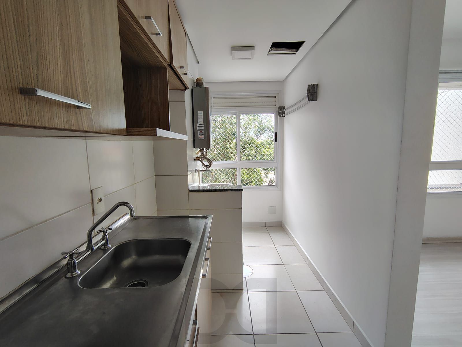 Apartamento de 2 dormitórios, living, cozinha planejada, área de serviço, banheiro social e 1 vaga de garagem escriturada. — foto 6