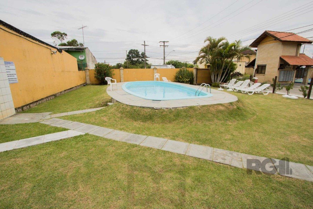 Casa em Condomínio na Zona Sul, no bairro Hípica, com 2 dormitórios, living para dois ambientes, cozinha mobiliada, lavabo — foto 38