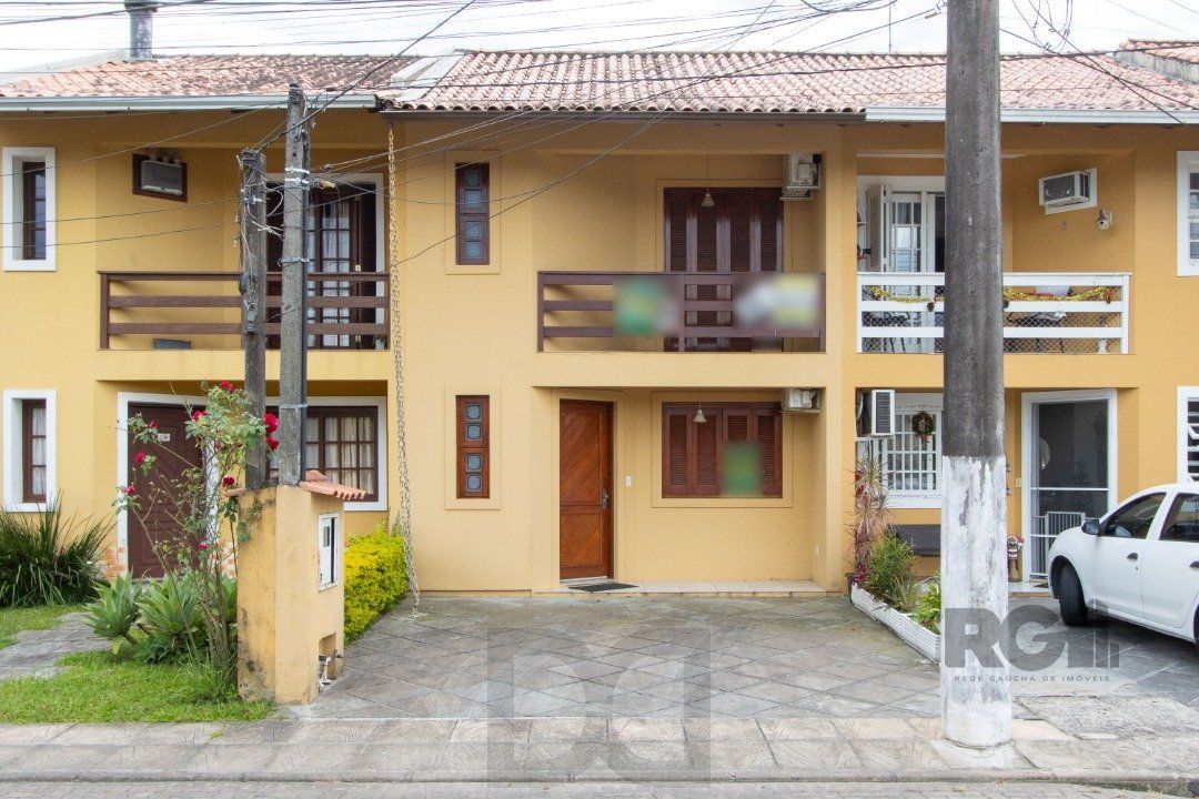 Casa em Condomínio na Zona Sul, no bairro Hípica, com 2 dormitórios, living para dois ambientes, cozinha mobiliada, lavabo — foto 2