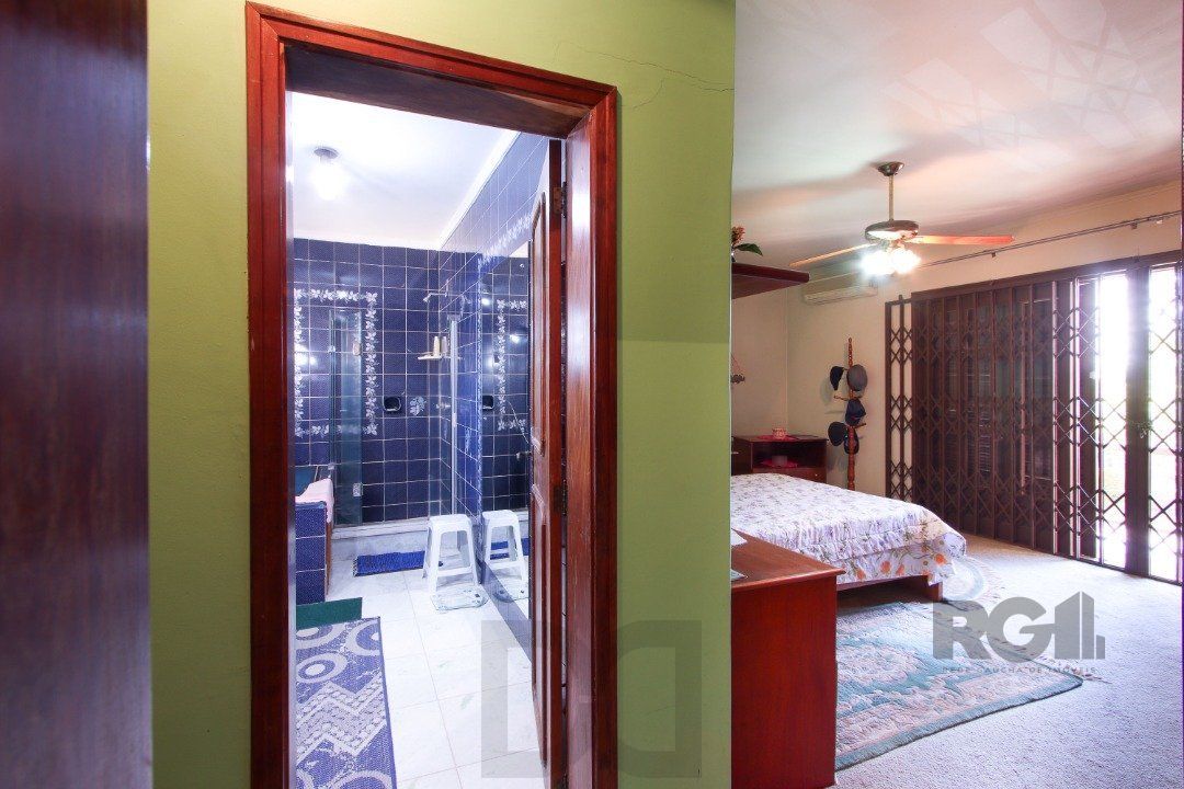 Casa a venda com 03 dormitórios, living 03 ambientes com vista para o Rio. — foto 35