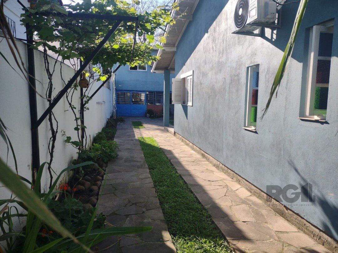 Casa com 250m², 2 quartos, 1 suite, edícula, no bairro Nonoai — foto 4