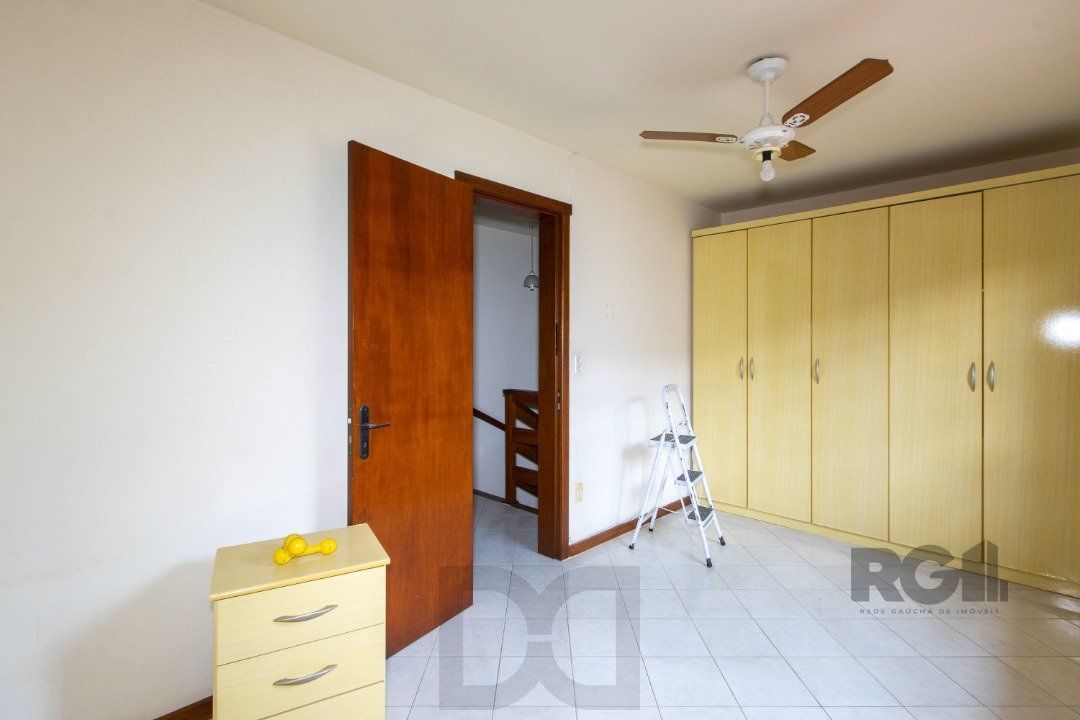 Casa em Condomínio na Zona Sul, no bairro Hípica, com 2 dormitórios, living para dois ambientes, cozinha mobiliada, lavabo — foto 32