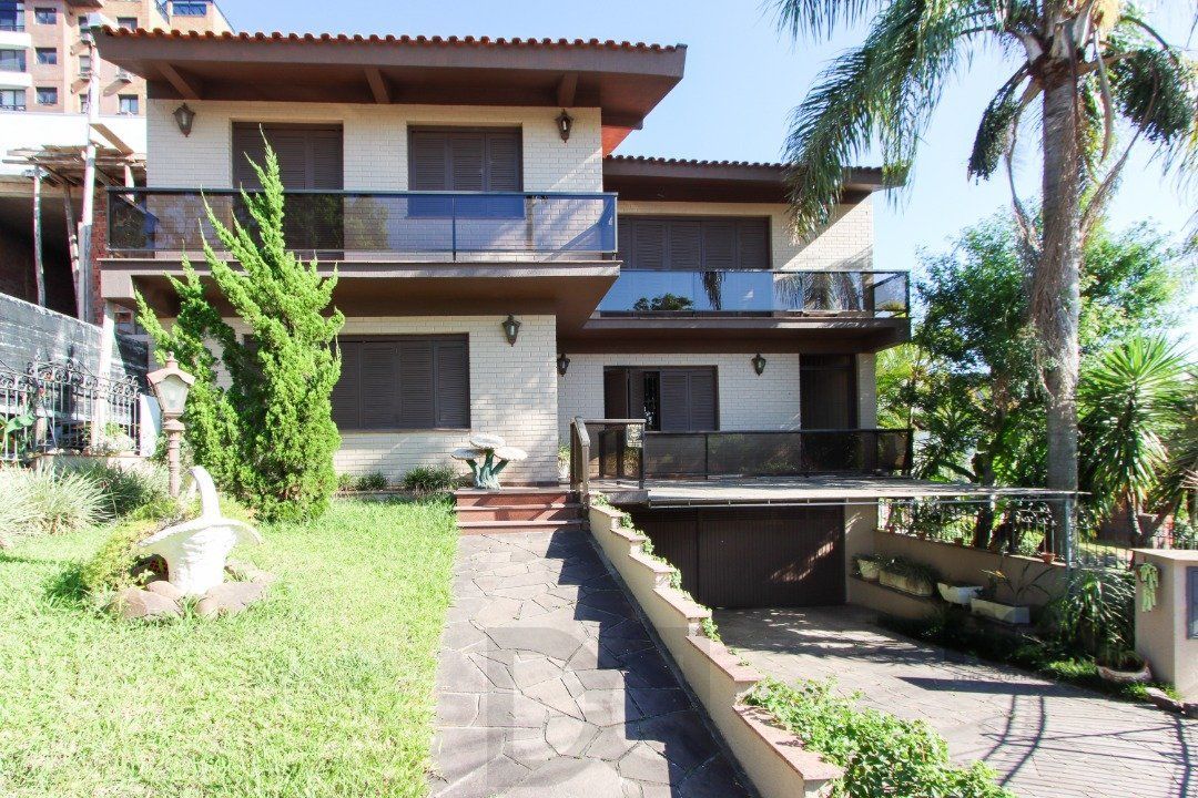 Casa a venda com 03 dormitórios, living 03 ambientes com vista para o Rio. — foto 1