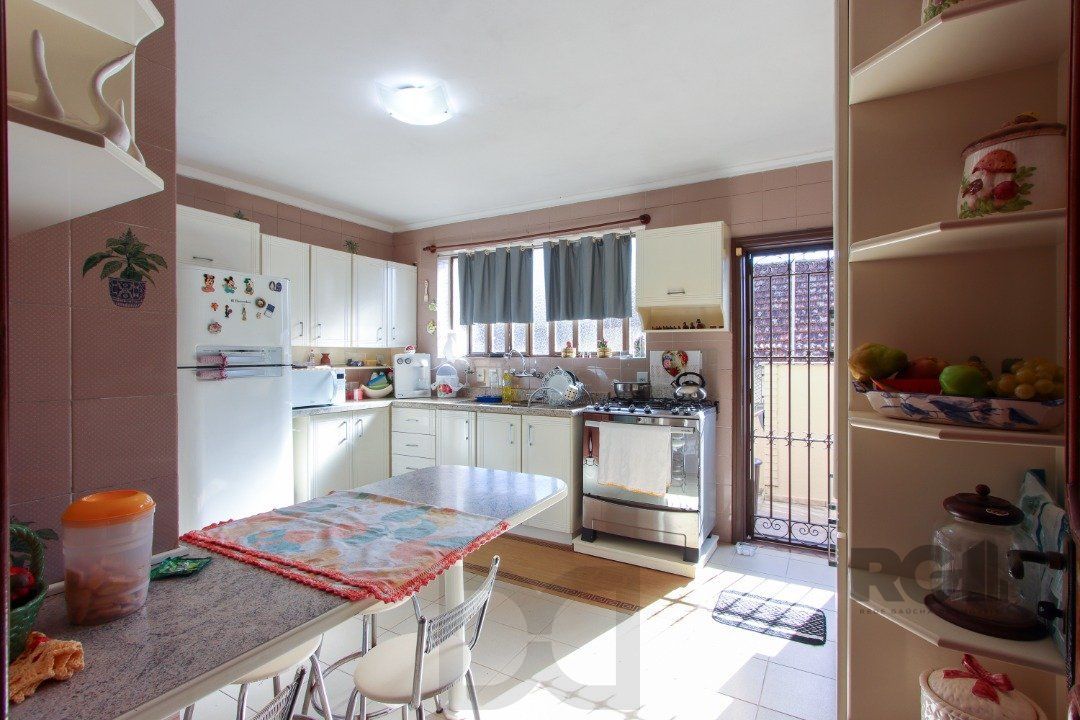 Casa a venda com 03 dormitórios, living 03 ambientes com vista para o Rio. — foto 18
