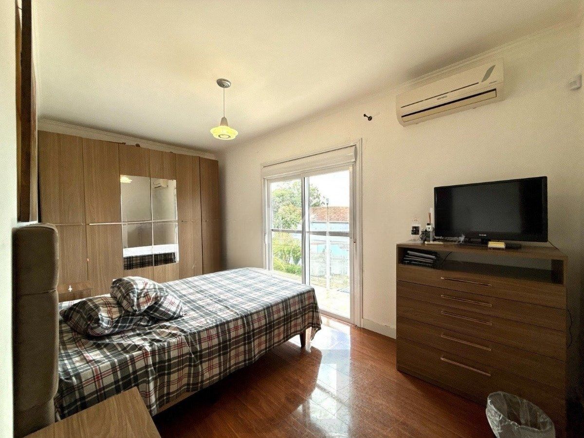 Casa ampla com 4 dormitórios, suíte e área de lazer- Passo da Areia — foto 18