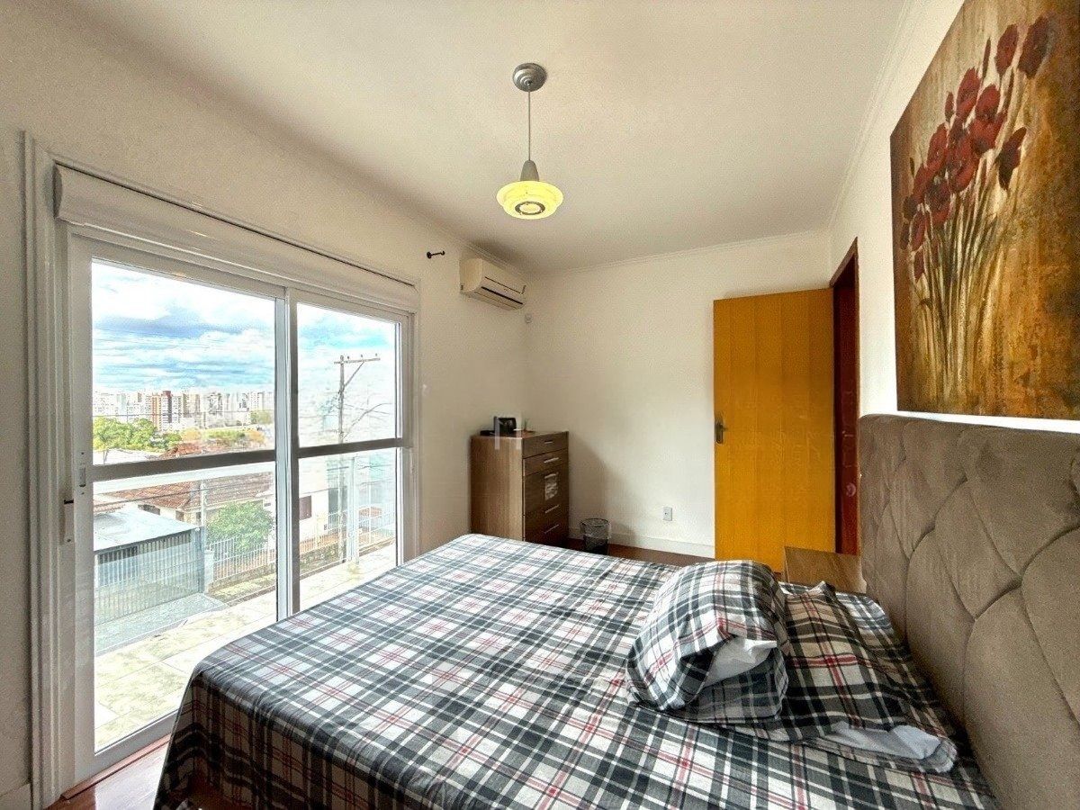 Casa ampla com 4 dormitórios, suíte e área de lazer- Passo da Areia — foto 17