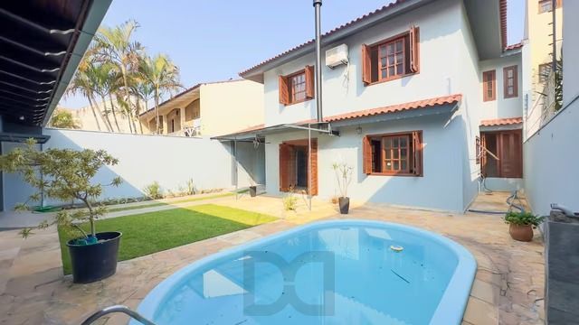 Casa térrea com 3 dormitórios, piscina, espaço gourmet com churrasqueira. — foto 1