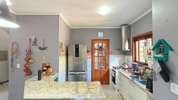 Casa em Porto Alegre, no bairro Hípica, com 3 dormitório(s), e 2 banheiros, à venda. — foto 16
