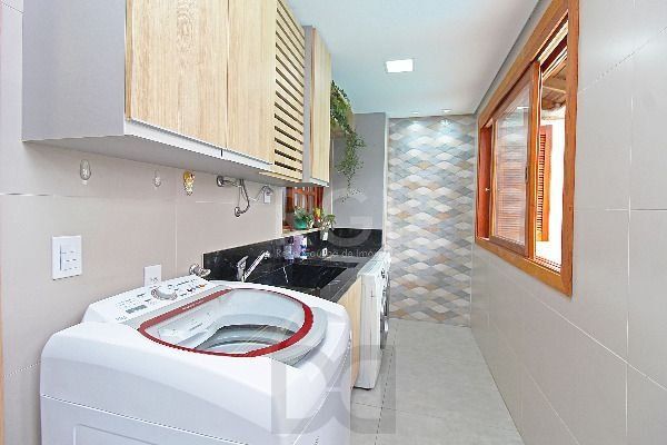 Casa em Porto Alegre, no bairro Hípica, com 3 dormitório(s), e 3 banheiros, à venda. — foto 19