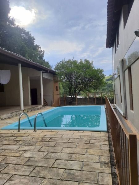 Casa em Porto Alegre, no bairro Vila Nova, com 4 dormitório(s), e 4 banheiros, à venda. — foto 10