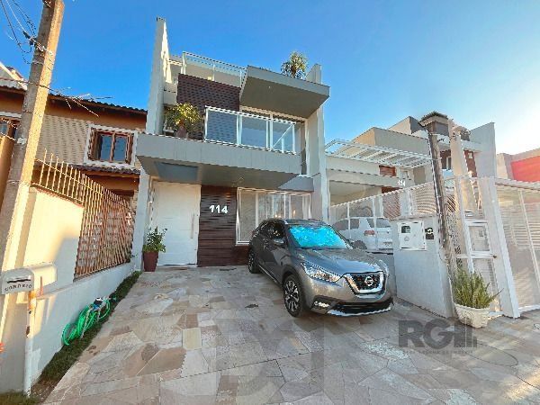 Casa em Porto Alegre, no bairro Hípica, com 3 dormitório(s), e 3 banheiros, à venda. — foto 1