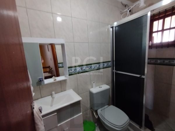 Casa em Porto Alegre, no bairro Hípica, com 3 dormitório(s), e 3 banheiros, à venda. — foto 16