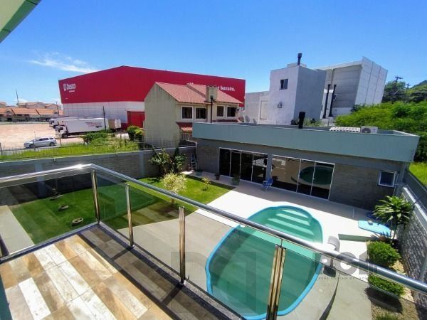 Casa em Porto Alegre, no bairro Hípica, com 3 dormitório(s), e 3 banheiros, à venda. — foto 10
