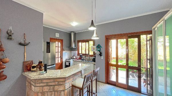 Casa em Porto Alegre, no bairro Hípica, com 3 dormitório(s), e 2 banheiros, à venda. — foto 15