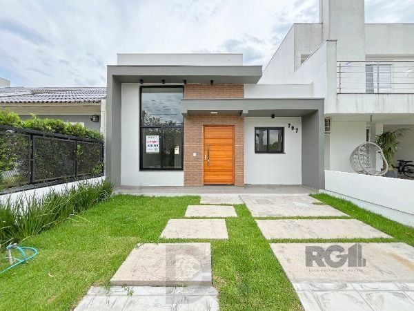 Casa em Porto Alegre, no bairro Hípica, com 3 dormitório(s), e 3 banheiros, à venda. — foto 1