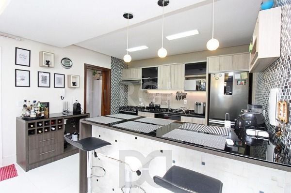 Casa em Porto Alegre, no bairro Hípica, com 3 dormitório(s), e 3 banheiros, à venda. — foto 11