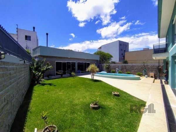 Casa em Porto Alegre, no bairro Hípica, com 3 dormitório(s), e 3 banheiros, à venda. — foto 19